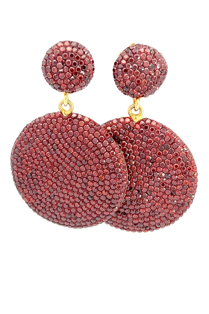 Rust crystal dangle earrings with double round pavé drops, polished gold-tone accents, and warm statement sparkle.