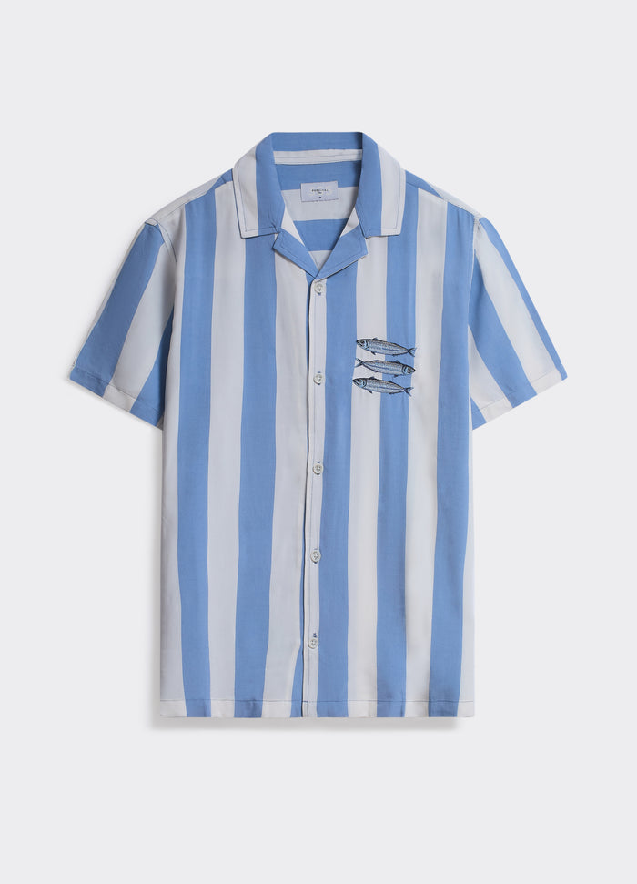 The Percival Sardines Shirt in blue and white vertical stripes, featuring chest embroidery and a classic camp collar.