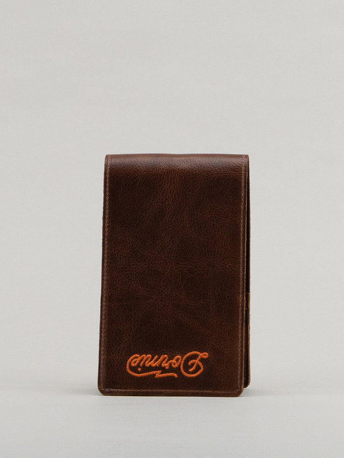 Brown leather yardage book with Dormie embroidery