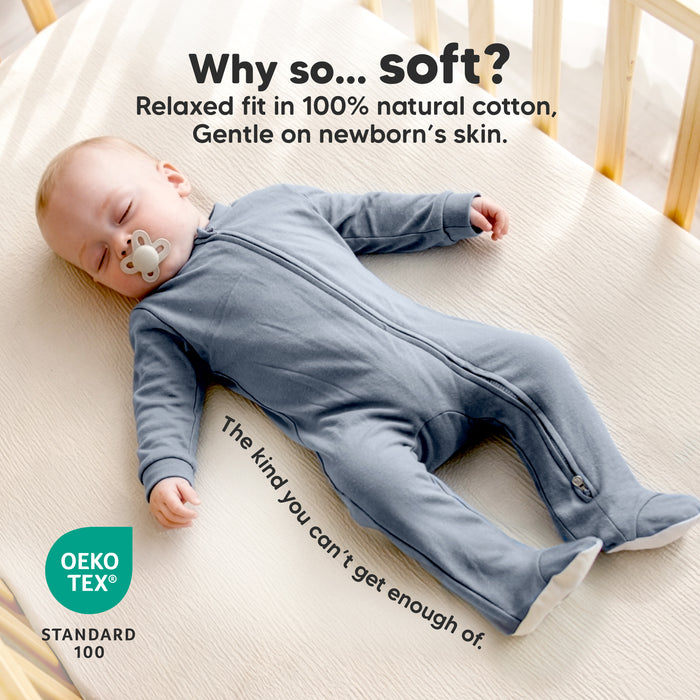Why so... soft? Relaxed fit in 100% natural cotton, gentle on newborn’s skin. The kind you can’t get enough of.