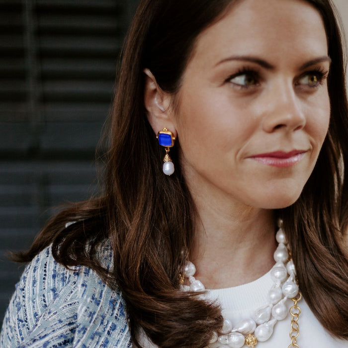 Model in the Susan Shaw Charlotte Mini Drop Earrings in Classic Blue
