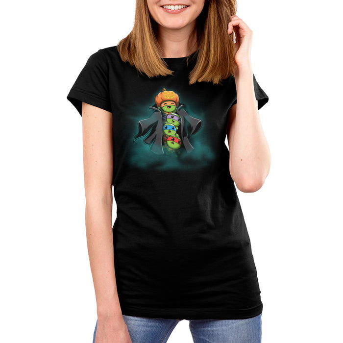 Premium Cotton T-shirt_TeeTurtle black TMNT Stack-o'-Lantern apparel featuring Michelangelo, Donatello, Leonardo, and Raphael in a stack wearing a trench coat with Michelangelo holding a pumpkin as their costume’s head, and with a spooky foggy background.