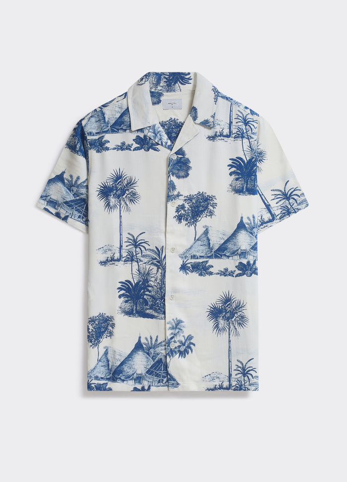 The Percival Tobago Shirt in white and blue, a short-sleeved camp-collar shirt with a tropical scenic print.