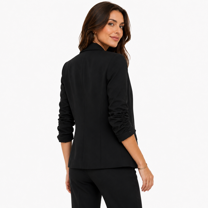 Casual office blazer for women with hip length cut, minimalist structure and versatile layering over jeans or dresses now fit
