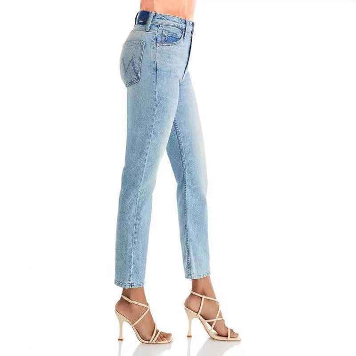 Light blue jeans worn by a person on a white background