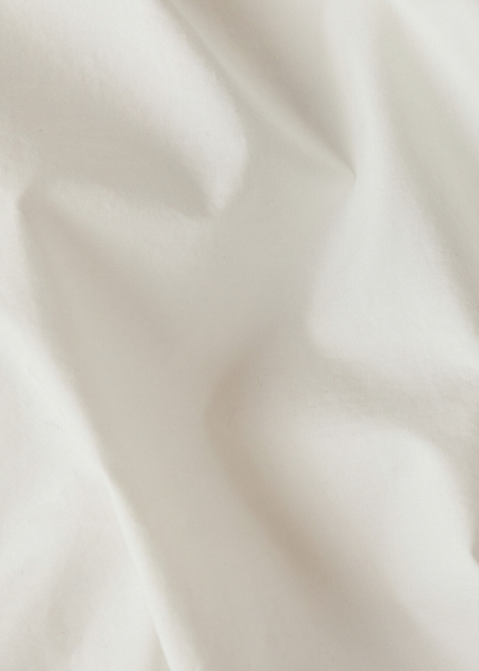 Close up of a white fabric top
